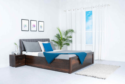 Grey wooden storage double bed with built-in drawers and mattress for cozy bedroom organization.