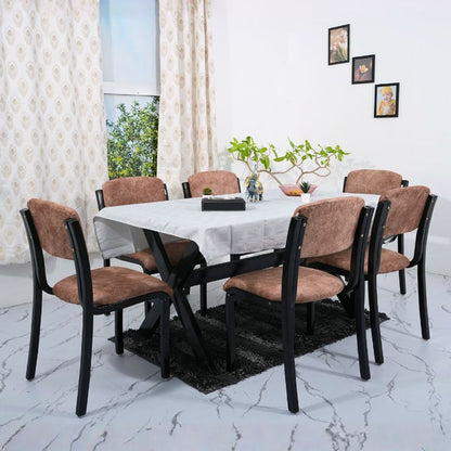 Dining table and six wooden chairs .