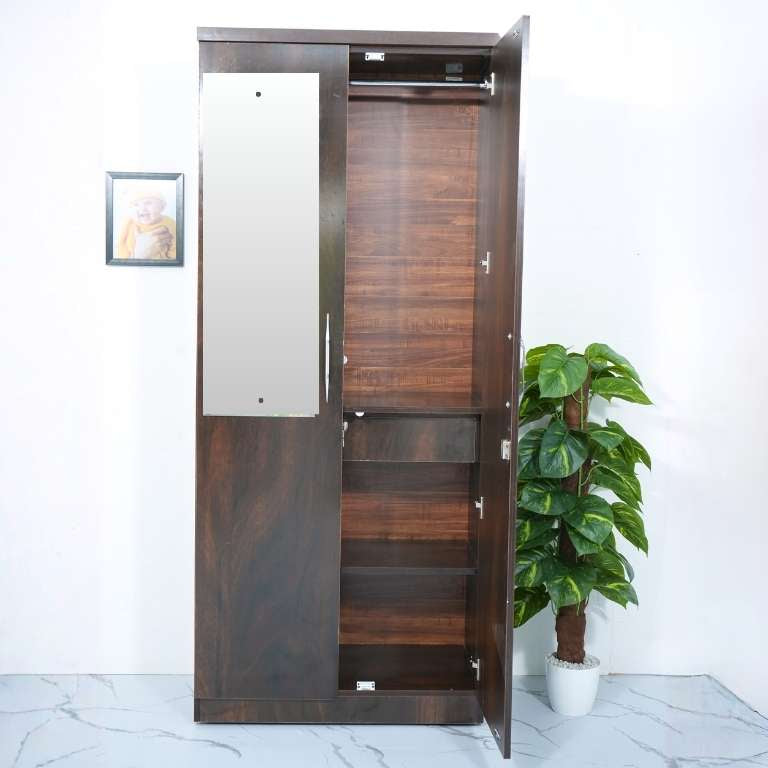 Wooden wardrobe with open door on a white background